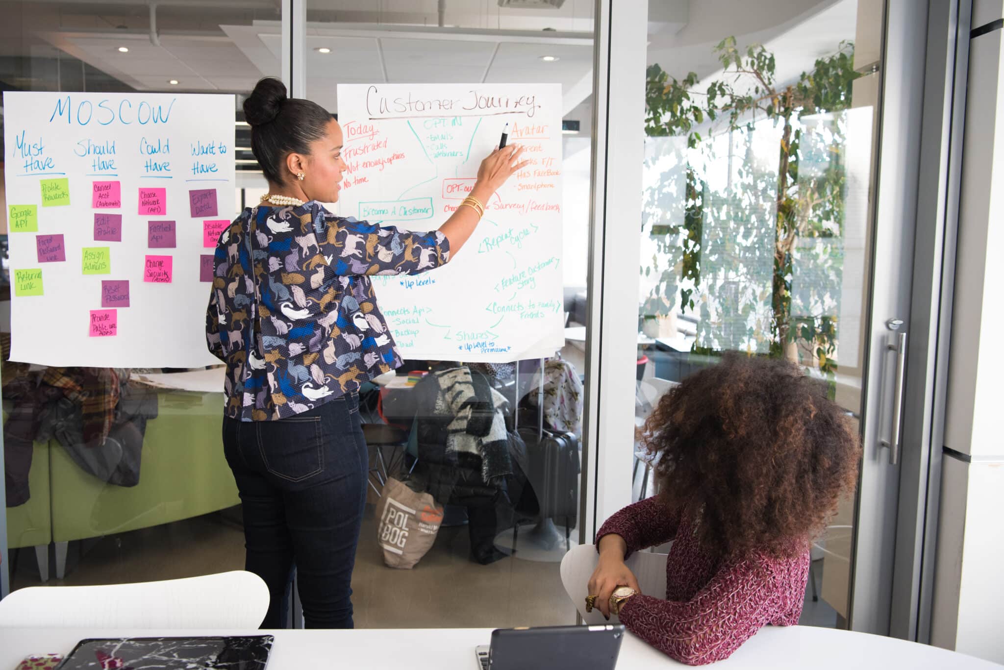 An image of a woman leading a meeting.