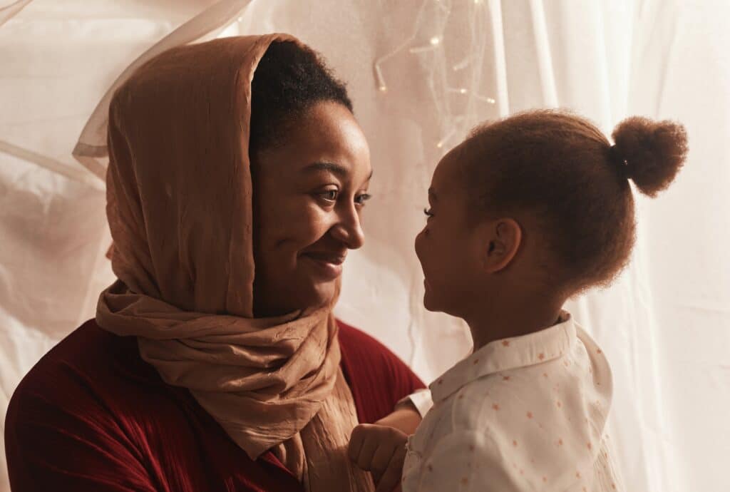 Woman and child smiling at each other